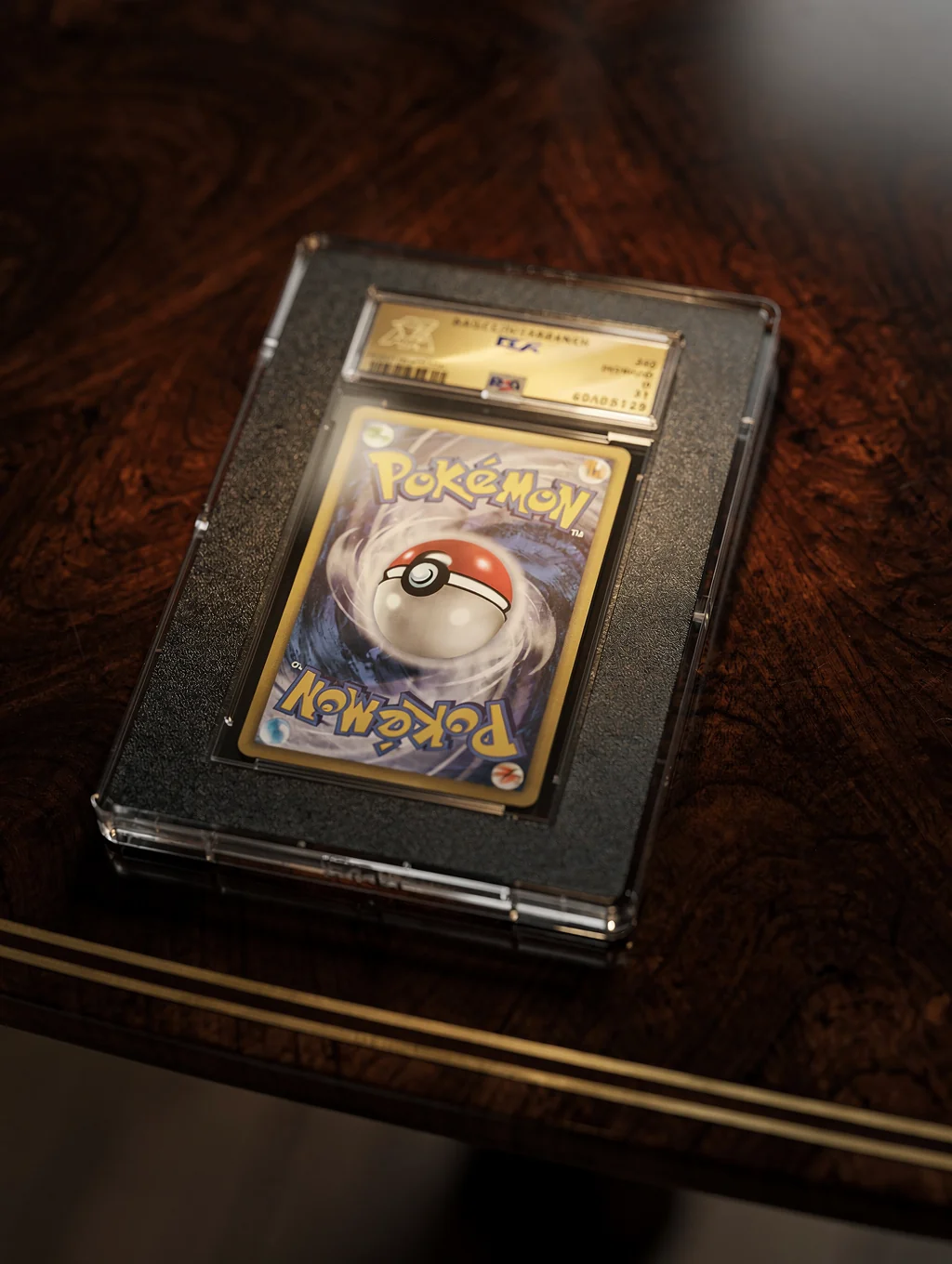 Graded collectible card slab in protective acrylic case